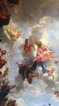 a painting of angels flying in the sky