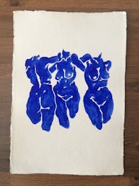 a drawing of three blue elephants on a piece of paper